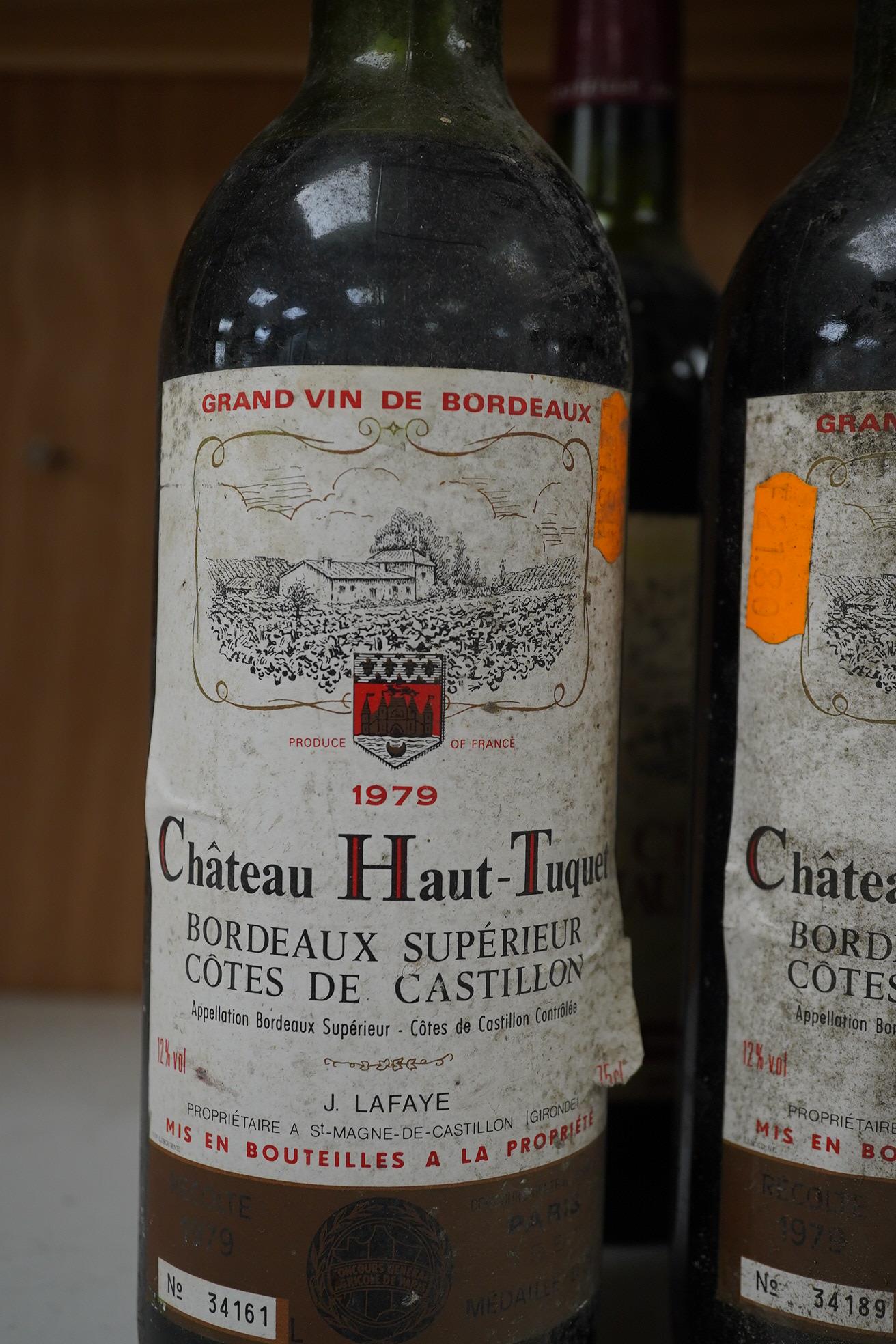 Ten bottles of French red wine to include Marquis D’Aulnay 1976 and Chateau Laroque 1986. Condition - storage unknown